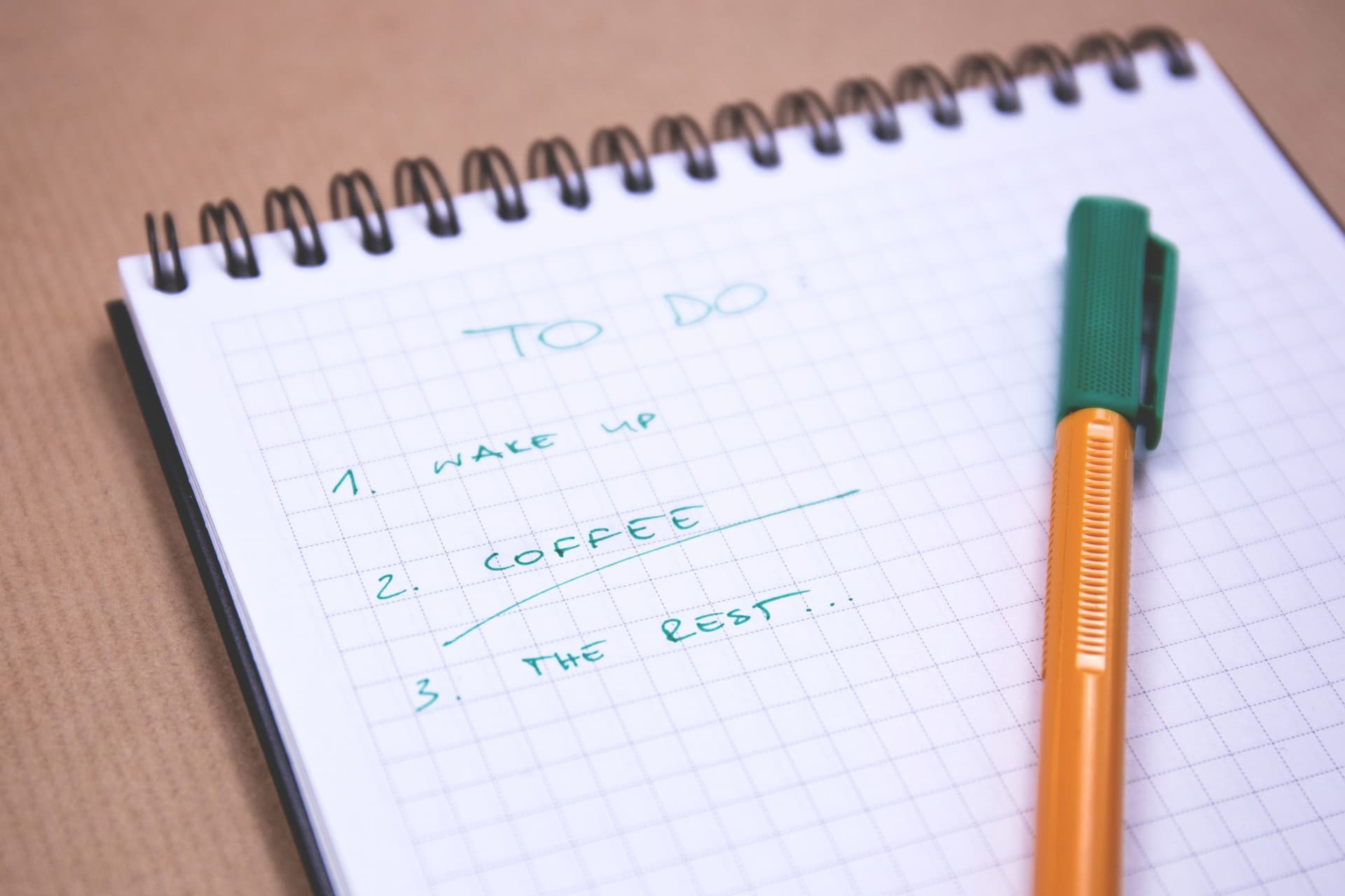 A written checklist on a clipboard beside camping gear