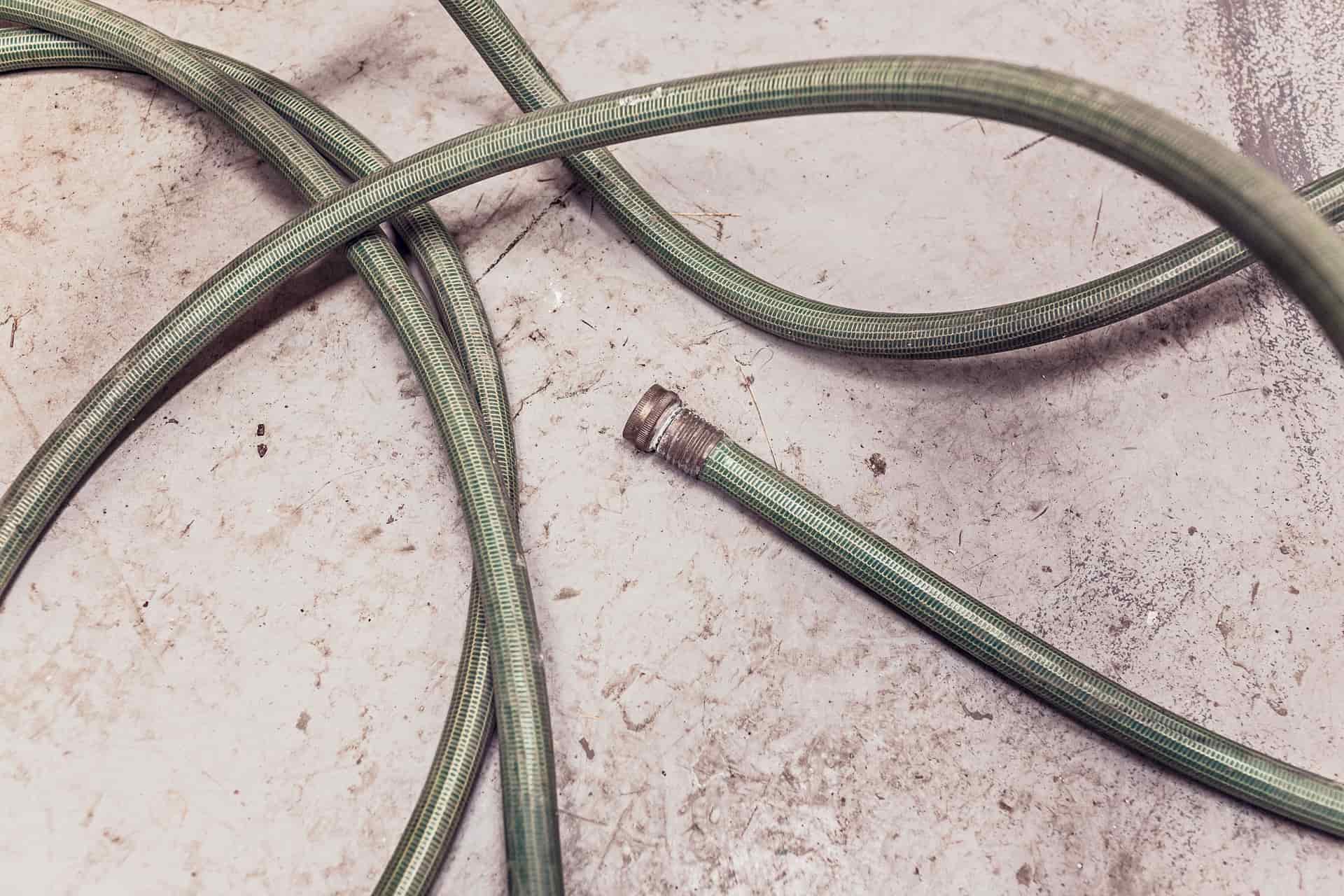Corrugated drain hose running to a campsite sewer connection