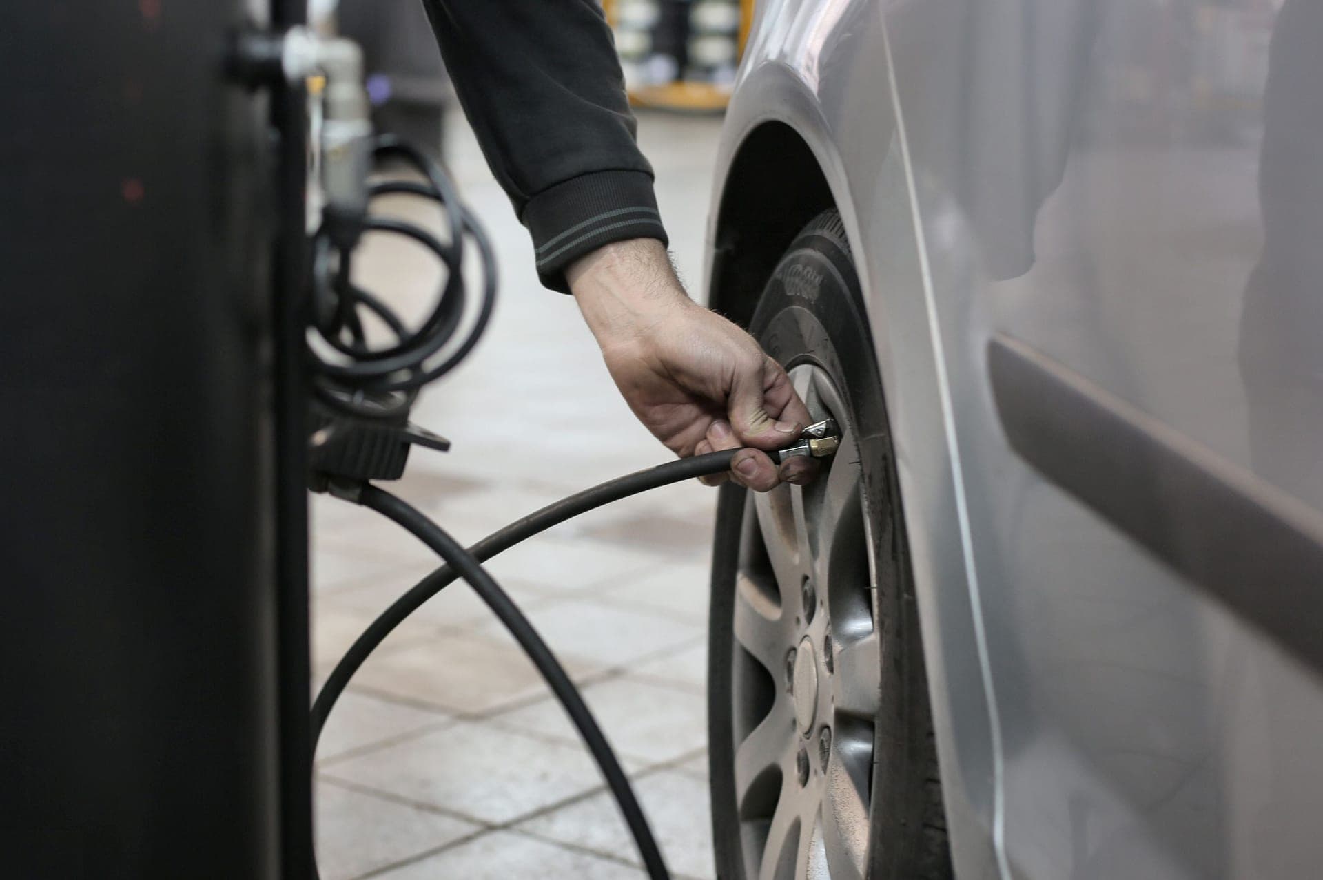 Checking a tire with a pressure gauge