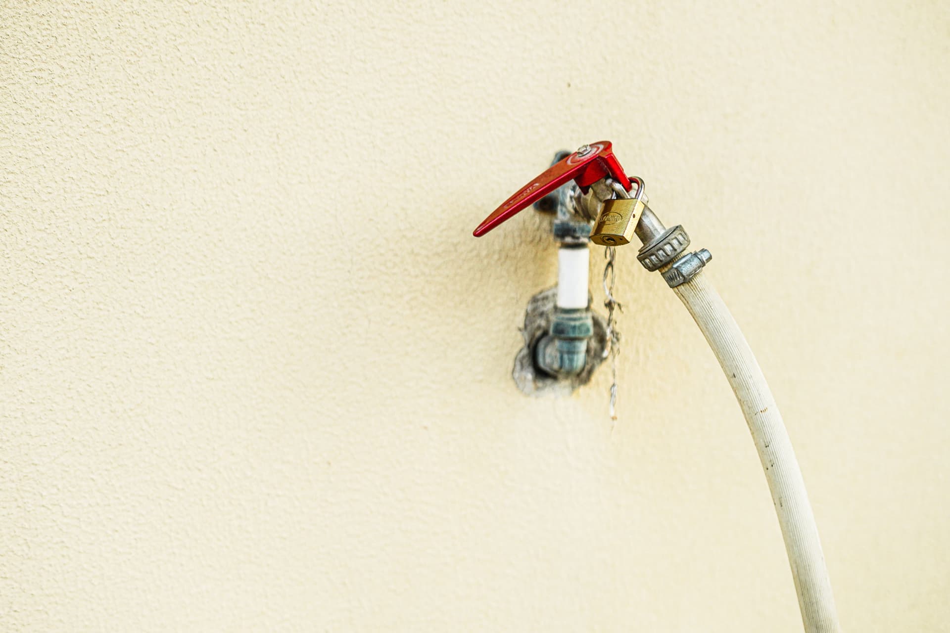 A water hookup and hose connection at a campsite